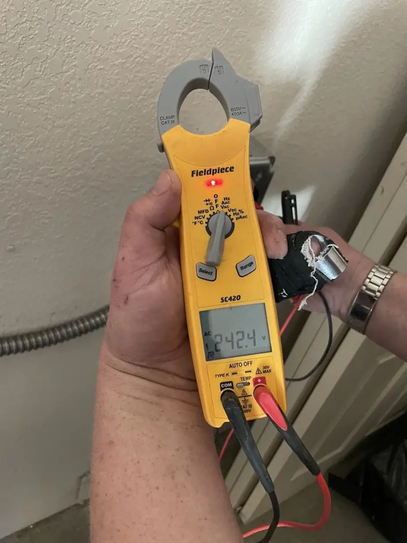 Voltage testing with clamp meter during Electrical Installation Services in Cheverly
